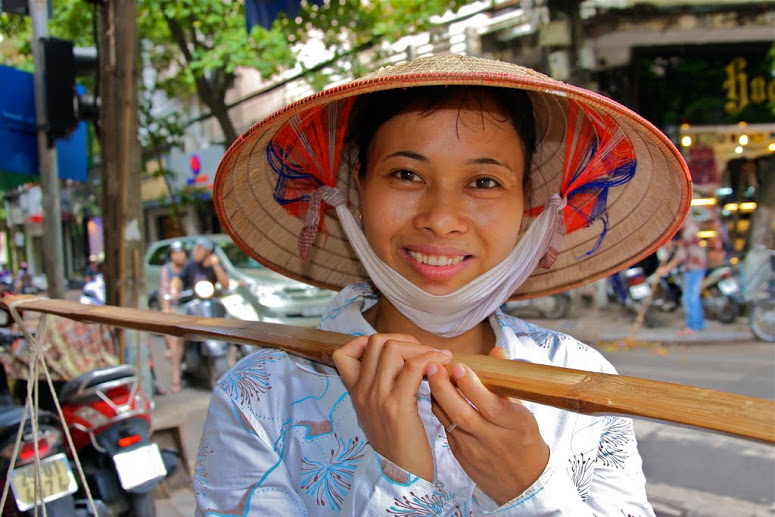 Vietnamese woman, vietnamese woman with cone hat, Things to Know Before you Go To Vietnam