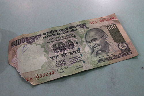 dealing with Indian currency and a torn rupee