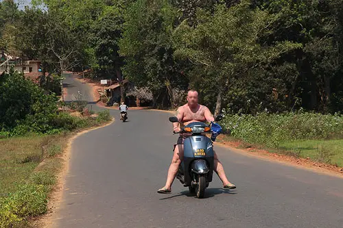 fat man on moped