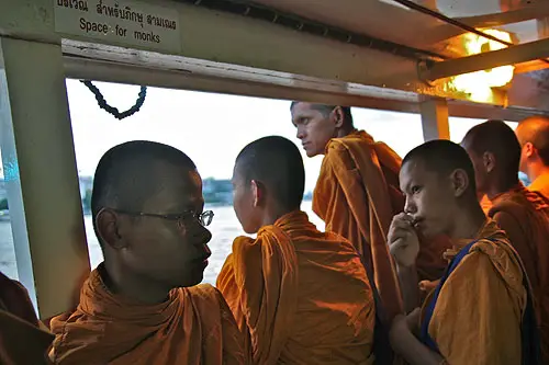 monks on a boat
