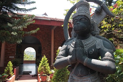 Yoga ashram hall with statue of Hanuman, India's monkey god