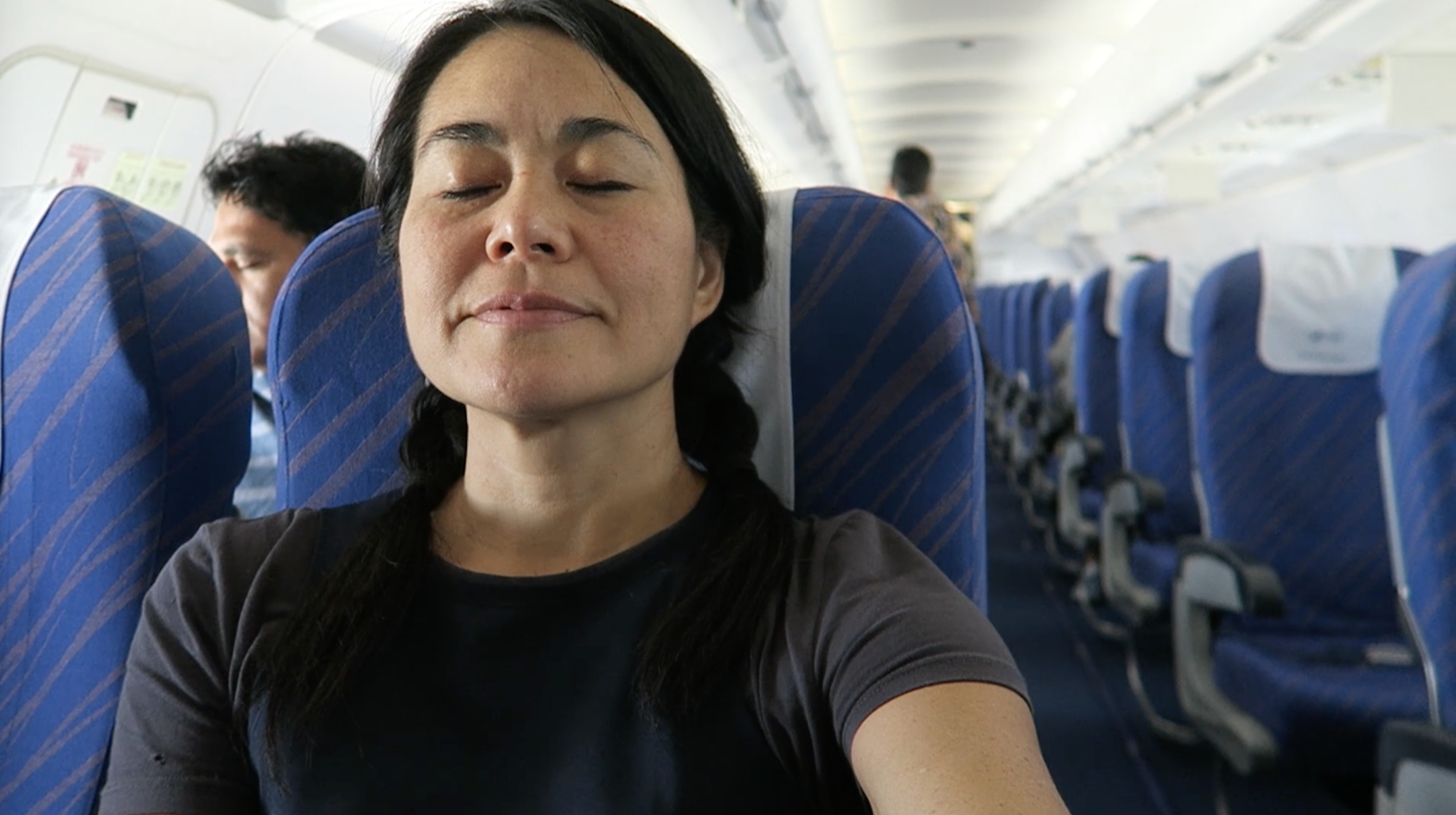 https://grrrltraveler.com/wp-content/uploads/2023/07/inflight-airplane-me.png